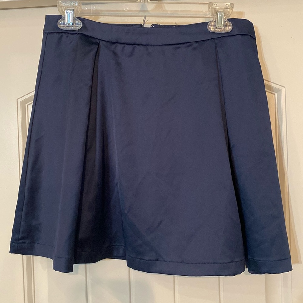 Navy blue “silky” pleated skirt.